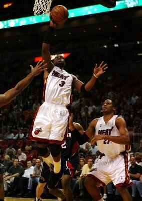 MIAMI - DECEMBER 12:  Dwyane Wade #3 of the Miami Heat scores against the Atlanta Hawks at American Airlines Arena on December 12, 2008 in Miami, Florida. NOTE TO USER: User expressly acknowledges and agrees that, by downloading and/or using this Photogra