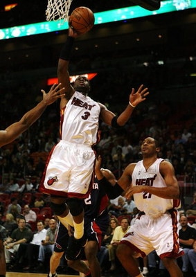 MIAMI - DECEMBER 12:  Dwyane Wade #3 of the Miami Heat scores against the Atlanta Hawks at American Airlines Arena on December 12, 2008 in Miami, Florida. NOTE TO USER: User expressly acknowledges and agrees that, by downloading and/or using this Photogra
