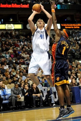 DALLAS - JANUARY Forward Dirk Nowitzki #41 of the Dallas Mavericks takes a shot against Stephen Jackson #1 of the Golden State Warriors on January 28, 2008 at American Airlines Center in Dallas, Texas. NOTE TO USER: User expressly acknowledges and agrees 