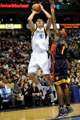 DALLAS - JANUARY Forward Dirk Nowitzki #41 of the Dallas Mavericks takes a shot against Stephen Jackson #1 of the Golden State Warriors on January 28, 2008 at American Airlines Center in Dallas, Texas. NOTE TO USER: User expressly acknowledges and agrees 