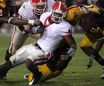 TEMPE, AZ - SEPTEMBER 20:  Running back Caleb King #4 of the Georgia Bulldogs is tackled by linebackers Morris Wooten #52 and Shelly Lyons #41 of the Arizona State Sun Devils on September 20, 2008 at Sun Devil Stadium in Tempe, Arizona.  Georgia won 27-10