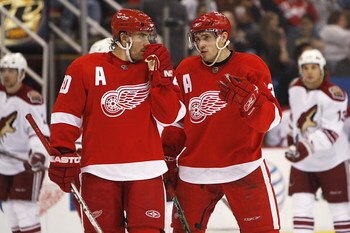 DETROIT - DECEMBER 1:  Henrik Zetterberg #40 and Pavel Datsyuk #13 of the Detroit Red Wings talk during the NHL game against the Phoenix Coyotes at the Joe Louis Arena on December 1, 2007 in Detroit, Michigan. (Photo by Gregory Shamus/Getty Images)