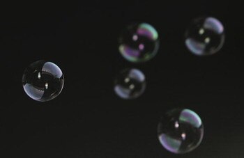 WIGAN, UNITED KINGDOM - FEBRUARY 02:  West Ham United fans blow bubbles during the Barclays Premier League match between Wigan Athletic and West Ham United at the JJB Stadium on February 02, 2008 in Wigan, England.  (Photo by Matthew Lewis/Getty Images)