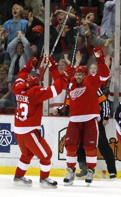 DETROIT - APRIL 03:  Henrik Zetterberg #40 of the Detroit Red Wings celebrates his game-winning goal with Pavel Datsyuk #13 of the Columbus Blue Jackets on April 3, 2008 at Joe Louis Arena in Detroit, Michigan. Detroit won the game 3-2. (Photo by Gregory 