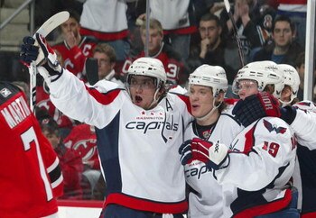 NEWARK, NJ - FEBRUARY 29:  Alex Ovechkin #8 (L)  and Nicklas Backstrom #19 (R) of the Washington Capitals celebrates a power play goal by Alexander Semin #28 (C) at 8:59 of the third period against the New Jersey Devils on February 29, 2008 at the Prudent