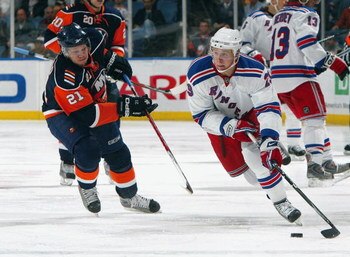 UNIONDALE, NY - MARCH 05:  Lauri Korpikoski #29 of the New York Rangers skates against Kyle Okposo #21 of the New York Islanders on March 5, 2009 at Nassau Coliseum in Uniondale, New York. The Rangers defeated the Islanders 4-2.  (Photo by Jim McIsaac/Get