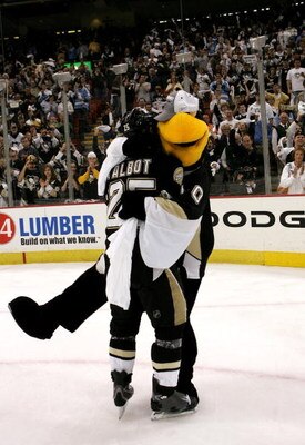 PITTSBURGH - MAY 18:  Maxime Talbot #25 of the Pittsburgh Penguins celebrates with mascot 'Iceburgh' after their team's 6-0 victory over the Philadelphia Flyers in game five of the Eastern Conference Finals of the 2008 NHL Stanley Cup Playoffs at Mellon A