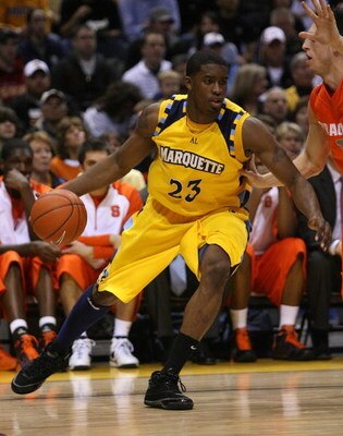 MILWAUKEE - MARCH 07: Wesley Matthews #23 of the Marquette Golden Eagles drives around Andy Rautins #1 of the Syracuse Orange on March 7, 2009 at the Bradley Center in Milwaukee, Wisconsin. Syracuse defeated Marquette 86-79 in overtime. (Photo by Jonathan