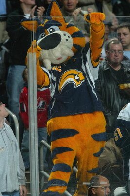BUFFALO, NY - NOVEMBER 23:  The Buffalo Sabres mascot Sabretooth climbs on the glass during the game against the Montreal Canadiens at HSBC Arena on November 23, 2007 in Buffalo, New York. (Photo by Dave Sandford/Getty Images)