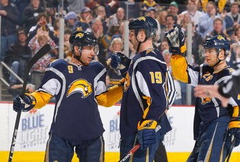 BUFFALO, NY - MARCH 06:  Derek Roy #9, Tim Connolly #19 and Jason Pominville #29 of the Buffalo Sabres celebrate Connolly's goal in the second period against the Phoenix Coyotes on March 6, 2009 at HSBC Arena in Buffalo, New York.  (Photo by Rick Stewart/