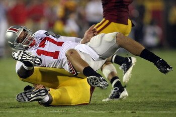 LOS ANGELES, CA - SEPTEMBER 13:  Quarterback Todd Boeckman #17 of the Ohio State Buckeyes lays on his back after being taken down by a USC Trojans defender during the college football game at the Los Angeles Memorial Coliseum on September 13, 2008 in Los 