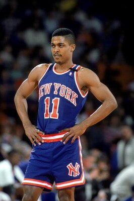 DENVER - 1989:  Rod Strickland #11 of the New York Knicks rests during an NBA game against the Denver Nuggets at McNichols Sports Arena in Denver, Colorado in 1989.  (Photo by: Tim Defrisco/Getty Images)