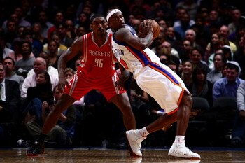 NEW YORK - JANUARY 26: Al Harrington #7 of the New York Knicks looks for options under pressure from Ron Artest #96 of the Houston Rockets at Madison Square Garden January 26, 2009 in New York City. NOTE TO USER: User expressly acknowledges and agrees tha