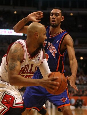 CHICAGO - DECEMBER 09:  Jared Jeffries #20 of the New York Knicks defends against Drew Gooden #90 of the Chicago Bulls at the United Center on December 9, 2008 in Chicago, Illinois. NOTE TO USER: User expressly acknowledges and agrees that, by downloading