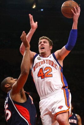 NEW YORK - MARCH 04:  David Lee #42 of the New York Knicks shoots over Al Horford #15 of the Atlanta Hawks at Madison Square Garden March 4, 2009 in New York City. NOTE TO USER: User expressly acknowledges and agrees that, by downloading and/or using this
