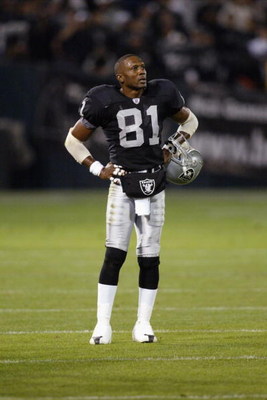 OAKLAND, CA - NOVEMBER 17:  Tim Brown #81 of the Oakland Raiders stands on the field with his helmet off during the game against the New England Patriots on November 17, 2002 at Network Associates Coliseum in Oakland, California. The Raiders defeated the 