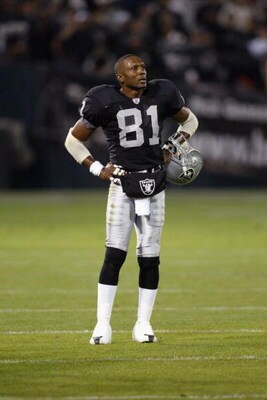 OAKLAND, CA - NOVEMBER 17:  Tim Brown #81 of the Oakland Raiders stands on the field with his helmet off during the game against the New England Patriots on November 17, 2002 at Network Associates Coliseum in Oakland, California. The Raiders defeated the 