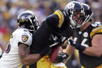 PITTSBURGH - DECEMBER 24:  Ben Roethlisberger #7 of the Pittsburgh Steelers is sacked by Dawan Landry #26 of the Baltimore Ravens on December 24, 2006 at Heinz Field in Pittsburgh, Pennsylvania.  (Photo by Chris McGrath/Getty Images)