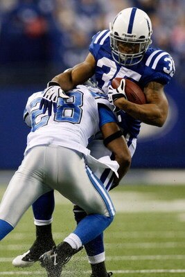 INDIANAPOLIS - DECEMBER 14:  Chad Simpson #35 of the Indianapolis Colts is tackled by Leigh Bodden #28 of the Detroit Lions on December 14, 2008 at Lucas Oil Stadium in Indianapolis, Indiana.  (Photo by Chris Graythen/Getty Images)