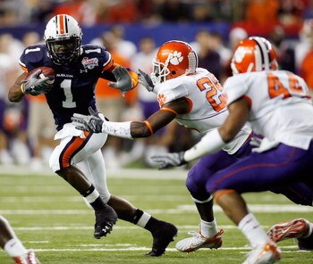 ATLANTA - DECEMBER 31:  Brad Lester #1 of the Auburn University Tigers runs around Michael Hamlin #25 of the Clemson Univeristy Tigers during the Chick-Fil-A Bowl on December 31, 2007 at the Georgia Dome in Atlanta, Georgia.  (Photo by Chris Graythen/Gett