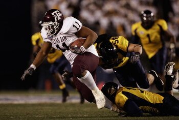 SAN DIEGO - DECEMBER 28:  Jorvorskie Lane #11 of the Texas A&M Aggies runs against the California Golden Bears during the 1st half of the Pacific Life Holiday Bowl on December 28, 2006 at Qualcomm Stadium in San Diego, California.  (Photo by Donald Mirall