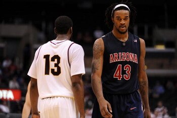 LOS ANGELES, CA - MARCH 12:  Forward Jordan Hill #43 of the Arizona Wildcats walks past guard James Harden #13 of the Arizona State Sun Devils during the final moments of their 68-56 loss to the Sun Devils during the Pacific Life Pac-10 Men's Basketball T
