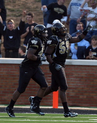 WINSTON SALEM, NC - OCTOBER 27: Aaron Curry #59 of the Wake Forest Demon Deacons celebrates his touchdown against the UNC Tar Heels during the ACC game at the Groves Stadium on October 27, 2007 in Winston Salem,North Carolina. (Photo by David Cannon/Get