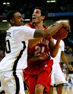 ATLANTA - MARCH 13:  Ishmael Smith #10 of the Wake Forest Demon Deacons reaches in for a steal against Greivis Vasquez #21 of the Maryland Terrapins during day two of the 2009 ACC Men's Basketball Tournament on March 13, 2009 at the Georgia Dome in Atlant