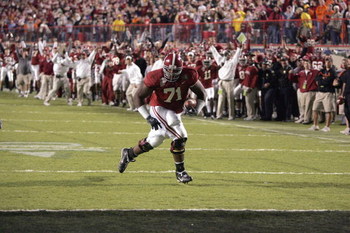 SHREVEPORT, LA - DECEMBER 28: Andre Smith #71 of Alabama runs in for a touchdown against Oklahoma State on December 28, 2006 during the PetroSun Independence Bowl at Independence Stadium in Shreveport, Louisiana. Oklahoma State defeated Alabama 34-31.