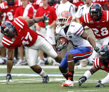 OXFORD, MS - SEPTEMBER 22: Percy Harvin #1 of the Florida Gators runs against Tony Fein #47 of the Mississippi Rebels on September 22, 2007 at Vaught-Hemingway Stadium/Hollingsworth Field in Oxford, Mississippi. (Photo by Joe Murphy/Getty Images)