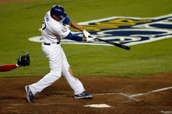 LOS ANGELES, CA - OCTOBER 15:  Matt Kemp #27 of the Los Angeles Dodgers hits a single in the fifth inning against the Philadelphia Phillies in Game Five of the National League Championship Series during the 2008 MLB playoffs on October 15, 2008 at Dodger 