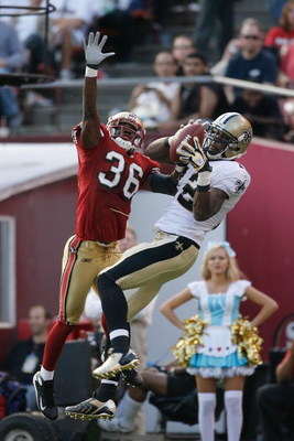 SAN FRANCISCO - OCTOBER 28: Wide receiver Marques Colston #12 of the New Orleans Saints catches a 15-yard touchdown pass over defensive back Shawntae Spencer #36 of the San Francisco 49ers during a game at Monster Park October 28, 2007 in San Francisco,