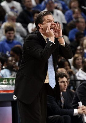 MEMPHIS, TN - MARCH 14: John Calipari, head coach of the Memphis Tigers calls out to his team against the Tulsa Golden Hurricane during the Championship of the Conference USA Basketball Tournament at FedExForum on March 14, 2009 in Memphis, Tennessee. Mem
