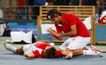 BEIJING - AUGUST 16:  Roger Federer (right) and Stanislas Wawrinka of Switzerland celebrate after defeating Thomas Johansson and Simon Aspelin of Sweden during the men's doubles gold medal tennis match at the Olympic Green Tennis Center on Day 8 of the Be