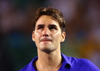 MELBOURNE, AUSTRALIA - FEBRUARY 01:  Roger Federer of Switzerland shows his emotion during the trophy presentation after his men's final match against Rafael Nadal of Spain during day fourteen of the 2009 Australian Open at Melbourne Park on  February 1, 
