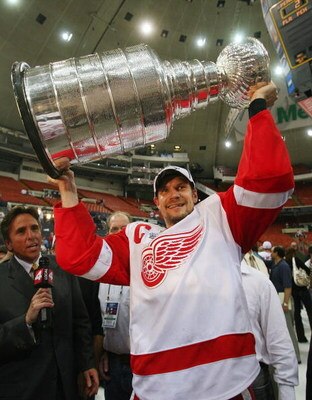 PITTSBURGH - JUNE 04: Nicklas Lidstrom #5 of the Detroit Red Wings celebrates with the Stanley Cup after defeating the Pittsburgh Penguins in game six of the 2008 NHL Stanley Cup Finals at Mellon Arena on June 4, 2008 in Pittsburgh. Pennsylvania. The Red 
