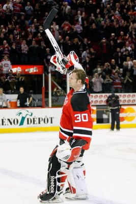 MONTREAL- MARCH 14:  Martin Brodeur #30 of the New Jersey Devils waves to the crowd after defeating the Montreal Canadiens and tying the NHL record for Career Wins of 551 at the Bell Centre on March 14, 2009 in Montreal, Quebec, Canada.  The Devils defeat