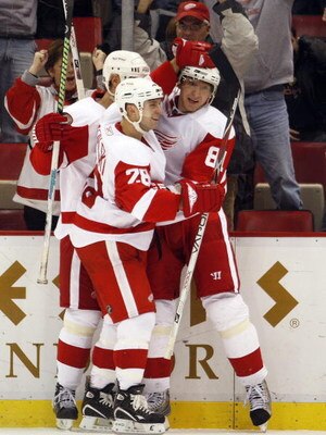 DETROIT, MI - DECEMBER 6:  Marian Hossa #81 of the Detroit Red Wings celebrates his tying goal with teammates Brian Rafalski #28 and Nicklas Lidstrom #5 in a game against the Chicago Black Hawks on December 6, 2008 at the Joe Louis Arena in Detroit, Michi