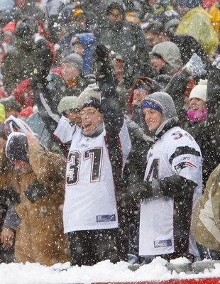 FOXBORO, MA - DECEMBER 21: Fans of the New England Patriots react after touchdown against the Arizona Cardinals at Gillette Stadium on December 21, 2008 in Foxboro, Massachusetts. The Patriots won 47-7. (Photo by Jim Rogash/Getty Images)