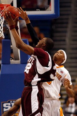 TAMPA, FL - MARCH 15:  Jarvis Varnado #32 of the Mississippi State Bulldogs makes a shot over Renaldo Woolridge #0 of the Tennessee Volunteers during the Championship game of the SEC Men's Basketball Tournament on March 15, 2009 at The St. Pete Times Foru