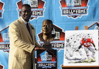 CANTON, OH - AUGUST 2: Andre Tippett of the New England Patriots poses with his bust after his induction during the Class of 2008 Pro Football Hall of Fame Enshrinement Ceremony at Fawcett Stadium on August 2, 2008 in Canton, Ohio.   (Photo by Al Messersc