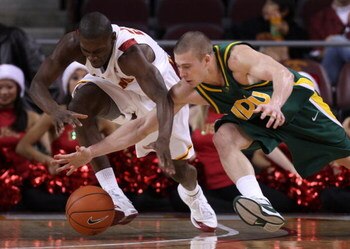LOS ANGELES, CA - DECEMBER 20:  Marcus Simmons #20 of the USC Trojans and Ben Woodside #10 of the North Dakota State Bison dive for the ball during the first half at the Galen Center on December 20, 2008 in Los Angeles, California. USC defeated North Dako