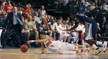 TAMPA, FL - MARCH 23:  A.J. Slaughter #4 of the Western Kentucky Hilltoppers and Clinton Houston #33 of the San Diego Toreros fight for a loose ball in the second round of the 2008 NCAA Tournament West Regional at the St. Pete Times Forum on March 23, 200