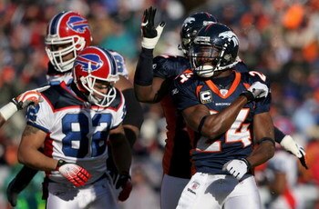 DENVER - DECEMBER 21:  Cornerback Champ Bailey #24 of the Denver Broncos celebrates after forcing a fumble by quarterback Trent Edwards of the Buffalo Bills during NFL action at Invesco Field at Mile High on December 21, 2008 in Denver, Colorado. Josh Ree