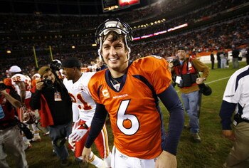 DENVER - DECEMBER 7: Quarterback Jay Cutler #6 of the Denver Broncos flashes a big smile as he shakes hands after beating the Kansas City Chiefs in week 14 NFL action at Invesco Field at Mile High on December 7, 2008 in Denver, Colorado. Denver beat Kansa