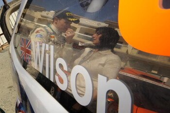 LIMASSOL, CYPRUS - MARCH 15:  Matthew Wilson of Great Britain and his mother talk in the last service park during Leg 3 of the WRC FxPro Rally of Cyprus 2009 on March 15, 2009 in Limassol, Cyprus.  (Photo by Massimo Bettiol/Getty Images)
