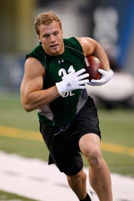 INDIANAPOLIS, IN - FEBRUARY 23:  Defensive lineman Paul Kruger of Utah runs with the football during the NFL Scouting Combine presented by Under Armour at Lucas Oil Stadium on February 23, 2009 in Indianapolis, Indiana. (Photo by Scott Boehm/Getty Images)