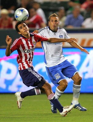 CARSON, CA - AUGUST 23:  Jonathan Bornstein #13 of CD Chivas USA looks to head the ball clear from Darren Huckerby #6 of San Jose Earthquakes in the first half during their MLS match at The Home Depot Center on August 23, 2008 in Carson, California.  (Pho