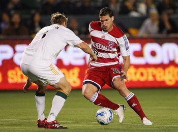 CARSON, CA - APRIL 12:  Ty Harden #3 of the Los Angeles Galaxy defends Kenny Cooper #33 of FC Dallas during their MLS match at The Home Depot Center on April 12, 2007 in Carson, California. FC Dallas defeated the Galaxy 2-1. (Photo by Jeff Gross/Getty Ima