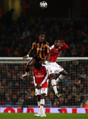 LONDON - MARCH 17:  Manucho of Hull city jumps for the ball with Johan Djourou of Arsenal during the the FA Cup Sponsored by E.on sixth round match between Arsenal and Hull City at Emirates Stadium on March 17, 2009 in London, England.  (Photo by Ryan Pie